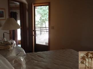 25160 Cougar Road Idyllwild, CA 92549 - Photo 15 of 17 a bedroom with a bed and a window