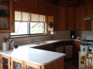 25160 Cougar Road Idyllwild, CA 92549 - Photo 6 of 17 a kitchen with a sink a window and cabinets