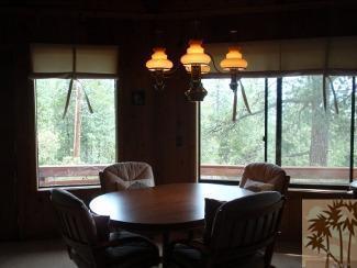 25160 Cougar Road Idyllwild, CA 92549 - Photo 8 of 17 a dining room with furniture and a large window