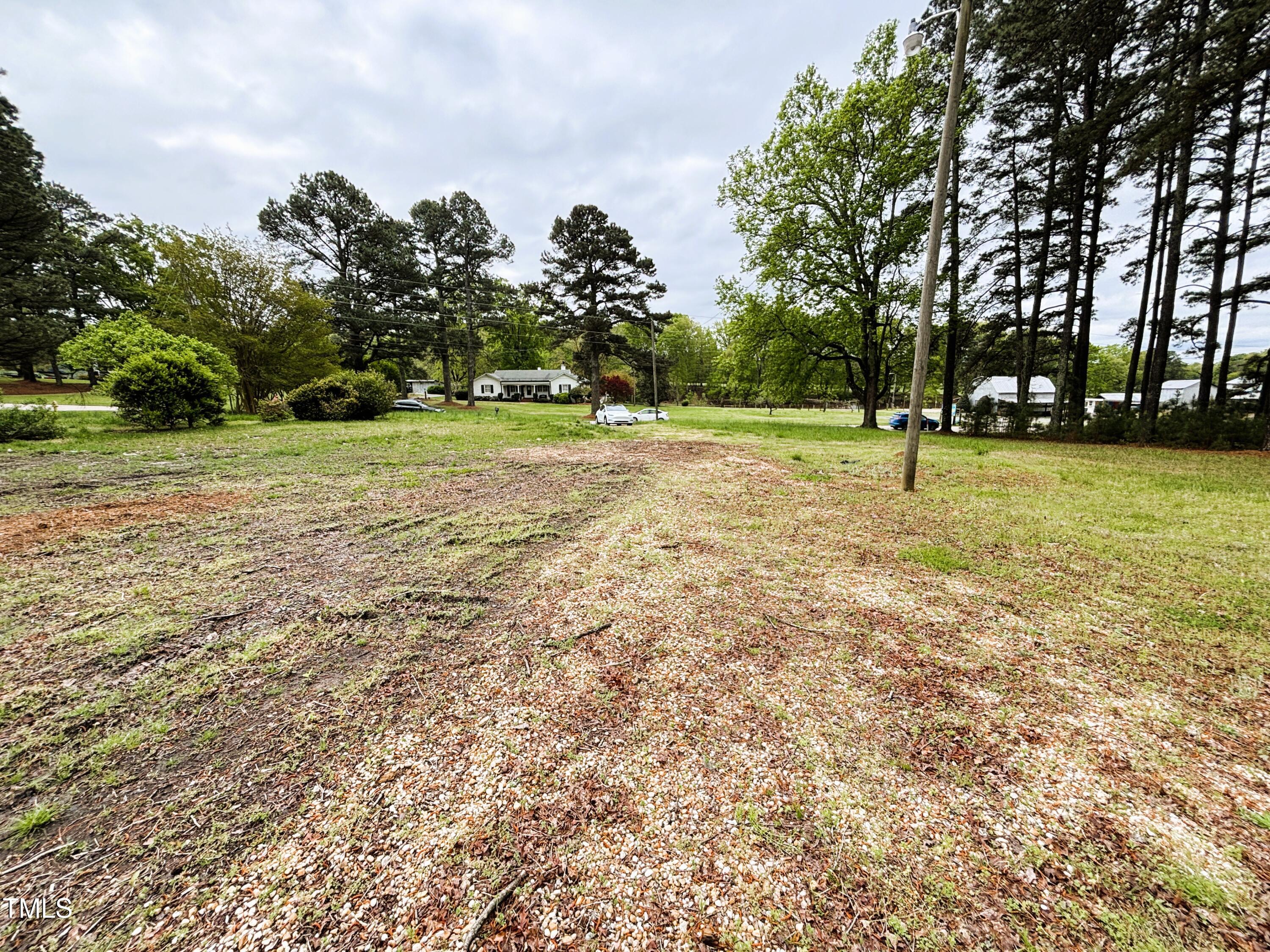1712 Avent Ferry Road Holly Springs, NC 27540 - Photo 5 of 6 a view of a field with trees