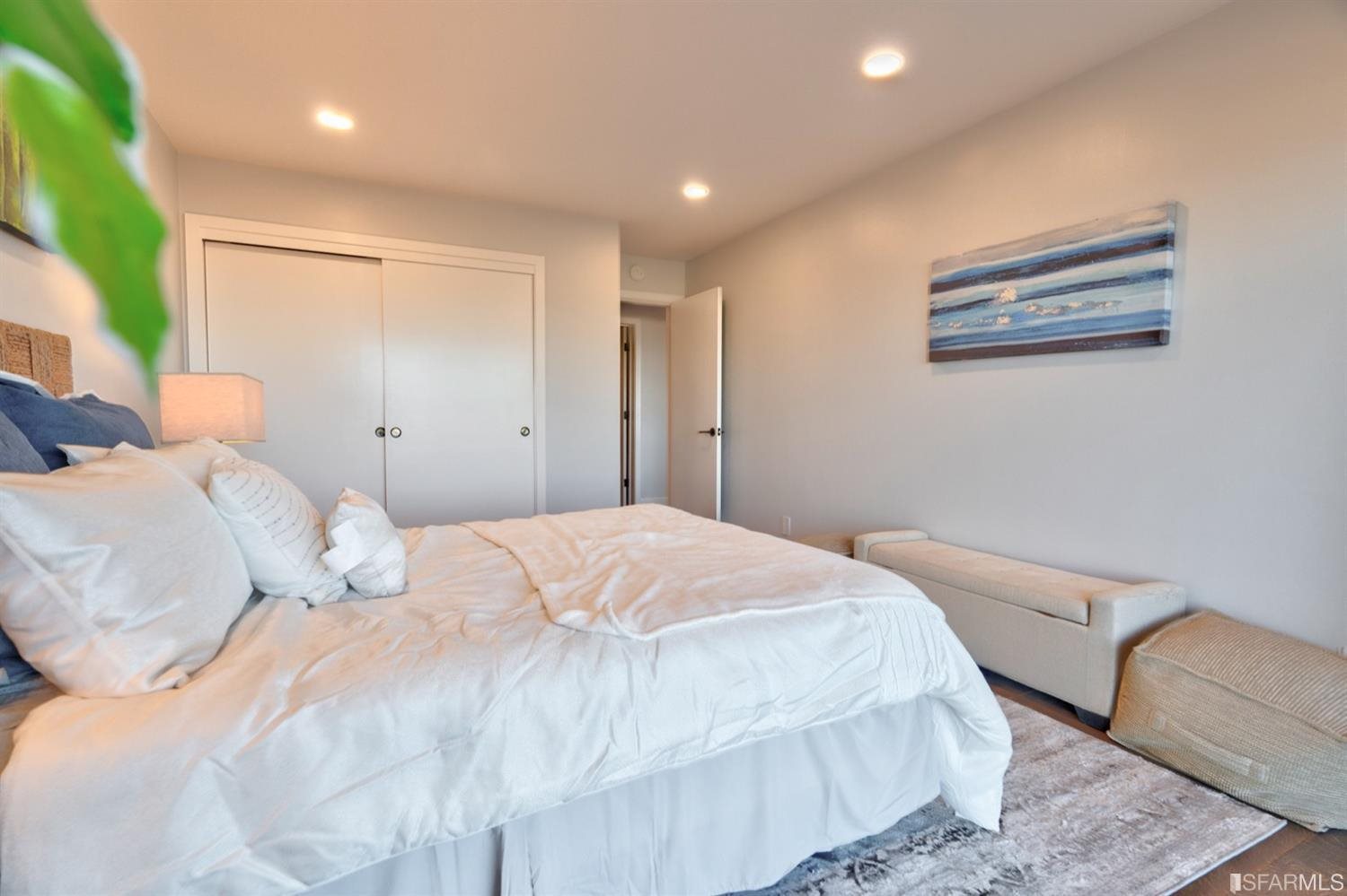 15 Perego Terrace, Unit 2 San Francisco, CA 94131 - Photo 20 of 45 a bedroom with a large bed and a couch