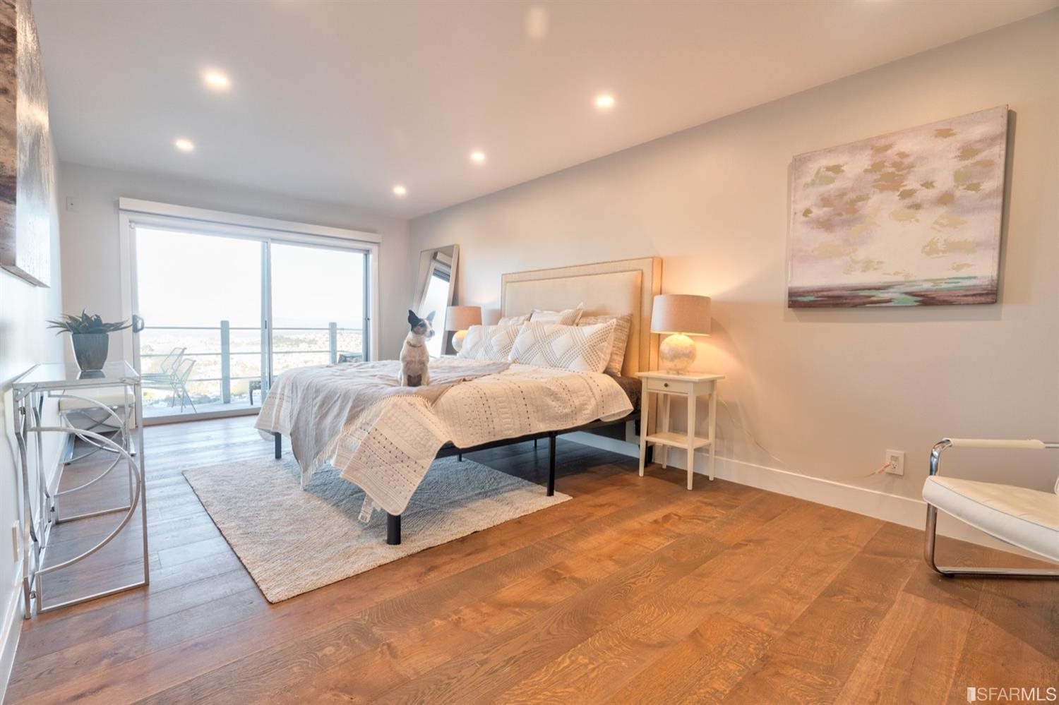 15 Perego Terrace, Unit 2 San Francisco, CA 94131 - Photo 21 of 45 a spacious bedroom with a bed a couch and large window