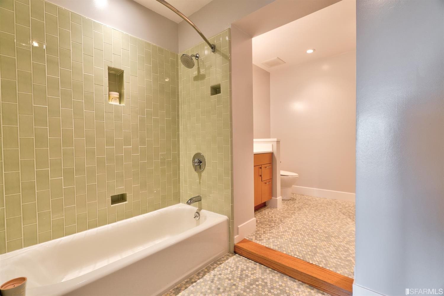 15 Perego Terrace, Unit 2 San Francisco, CA 94131 - Photo 29 of 45 a bathroom with a tub shower and sink