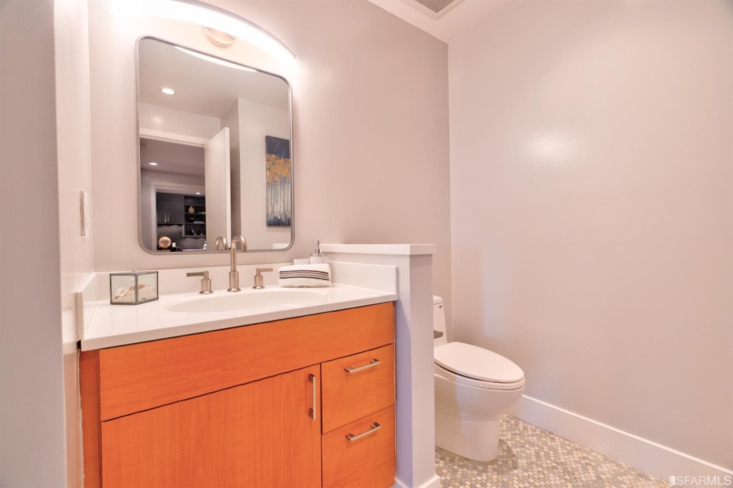 15 Perego Terrace, Unit 2 San Francisco, CA 94131 - Photo 30 of 45 a bathroom with a toilet a sink and mirror