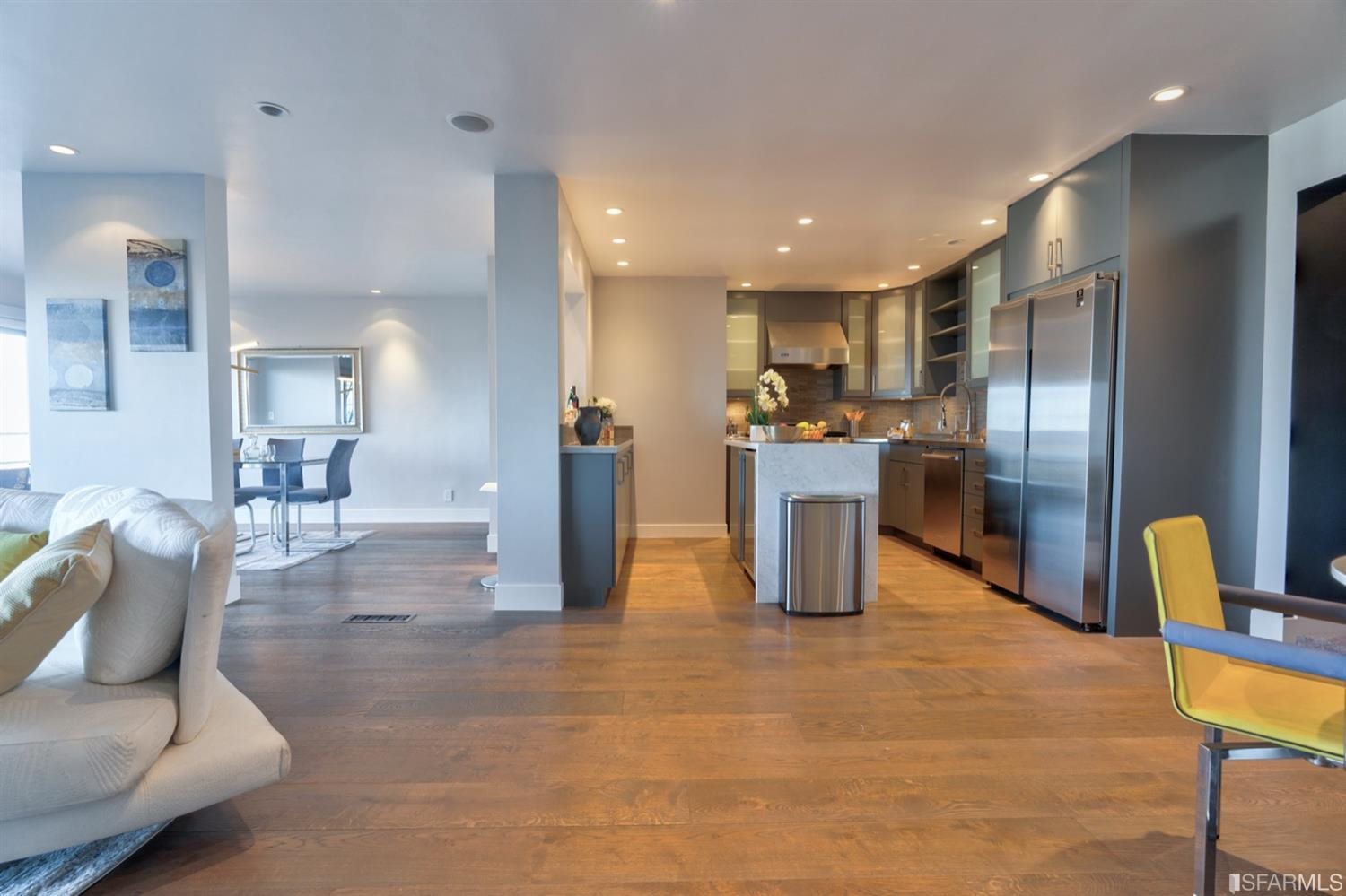 15 Perego Terrace, Unit 2 San Francisco, CA 94131 - Photo 7 of 45 a kitchen with stainless steel appliances kitchen island granite countertop dining table chairs and a refrigerator
