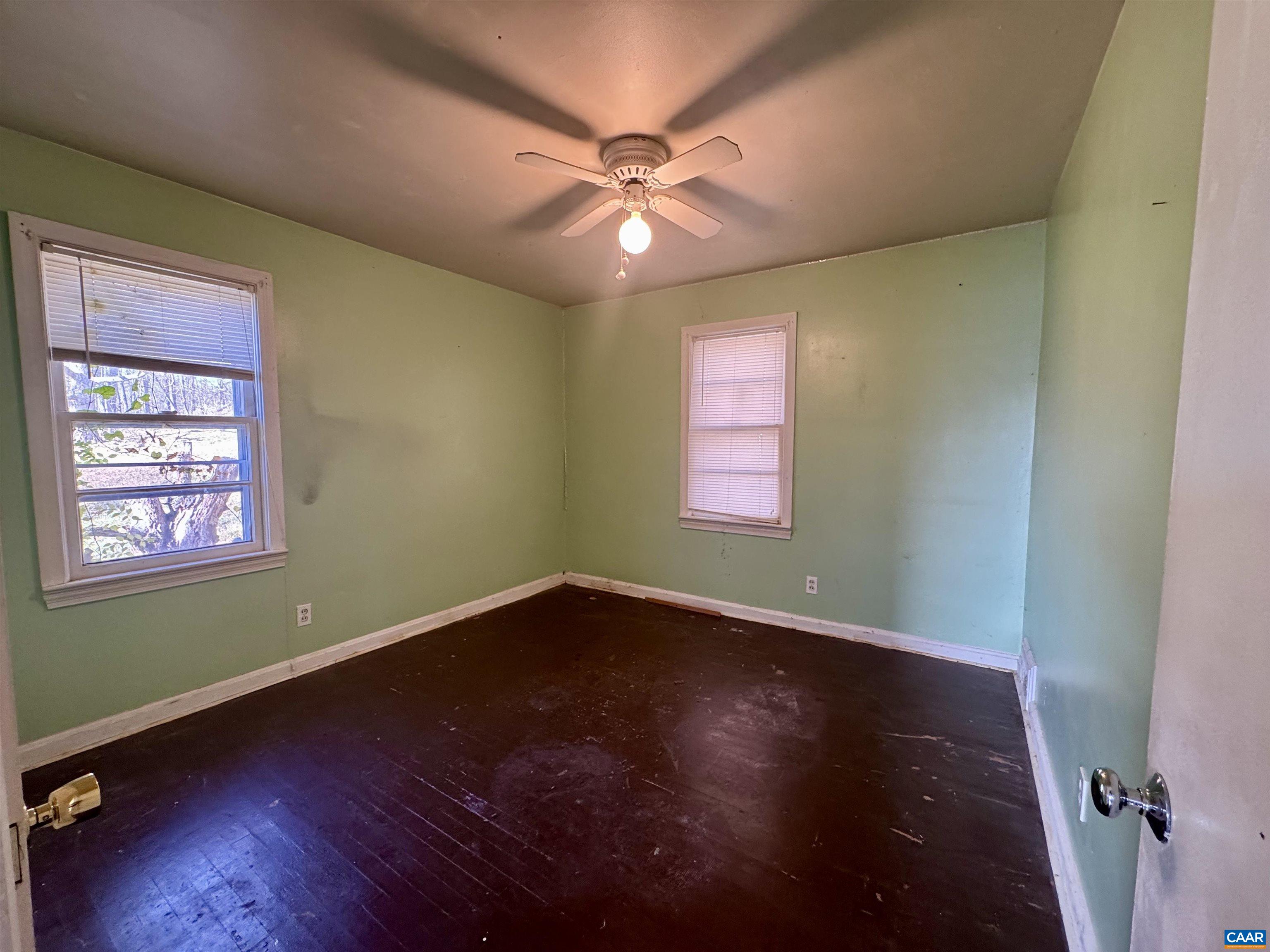 1323 Jackson Street Staunton, VA 24401 - Photo 18 of 67 an empty room with wooden floor fan and windows