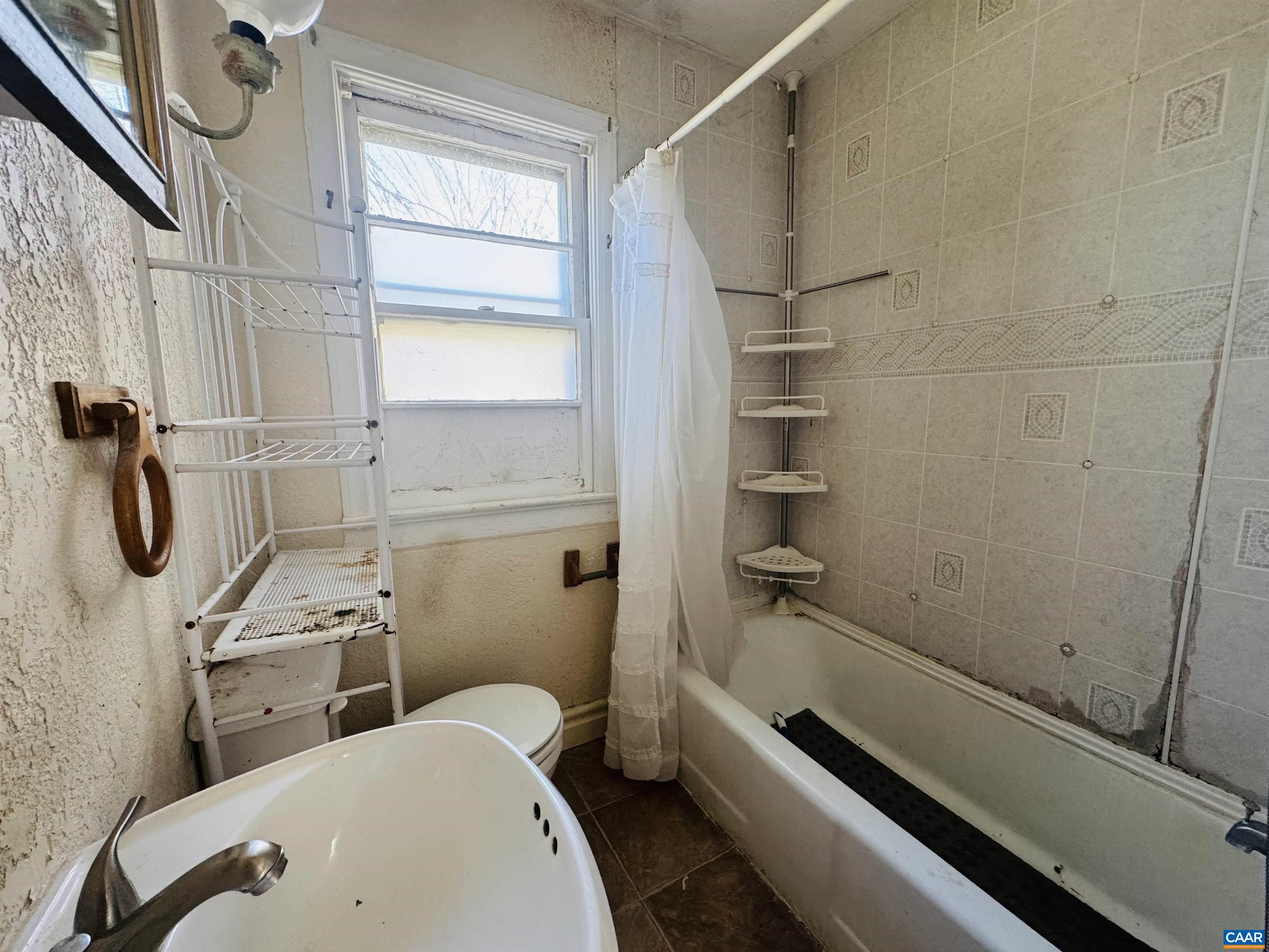 1323 Jackson Street Staunton, VA 24401 - Photo 23 of 67 a bathroom with a toilet and a shower