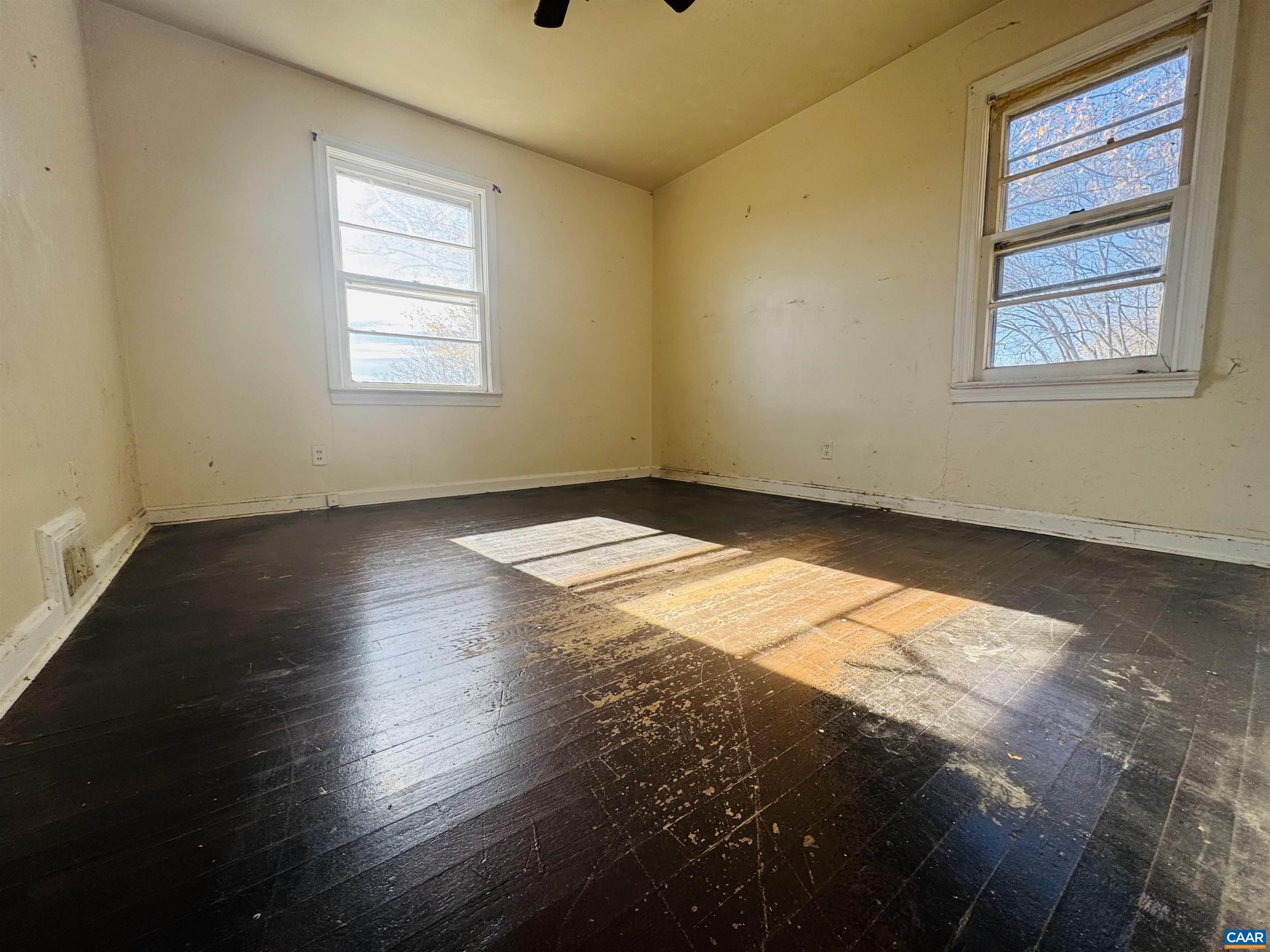 1323 Jackson Street Staunton, VA 24401 - Photo 25 of 67 a view of an empty room with wooden floor and a window