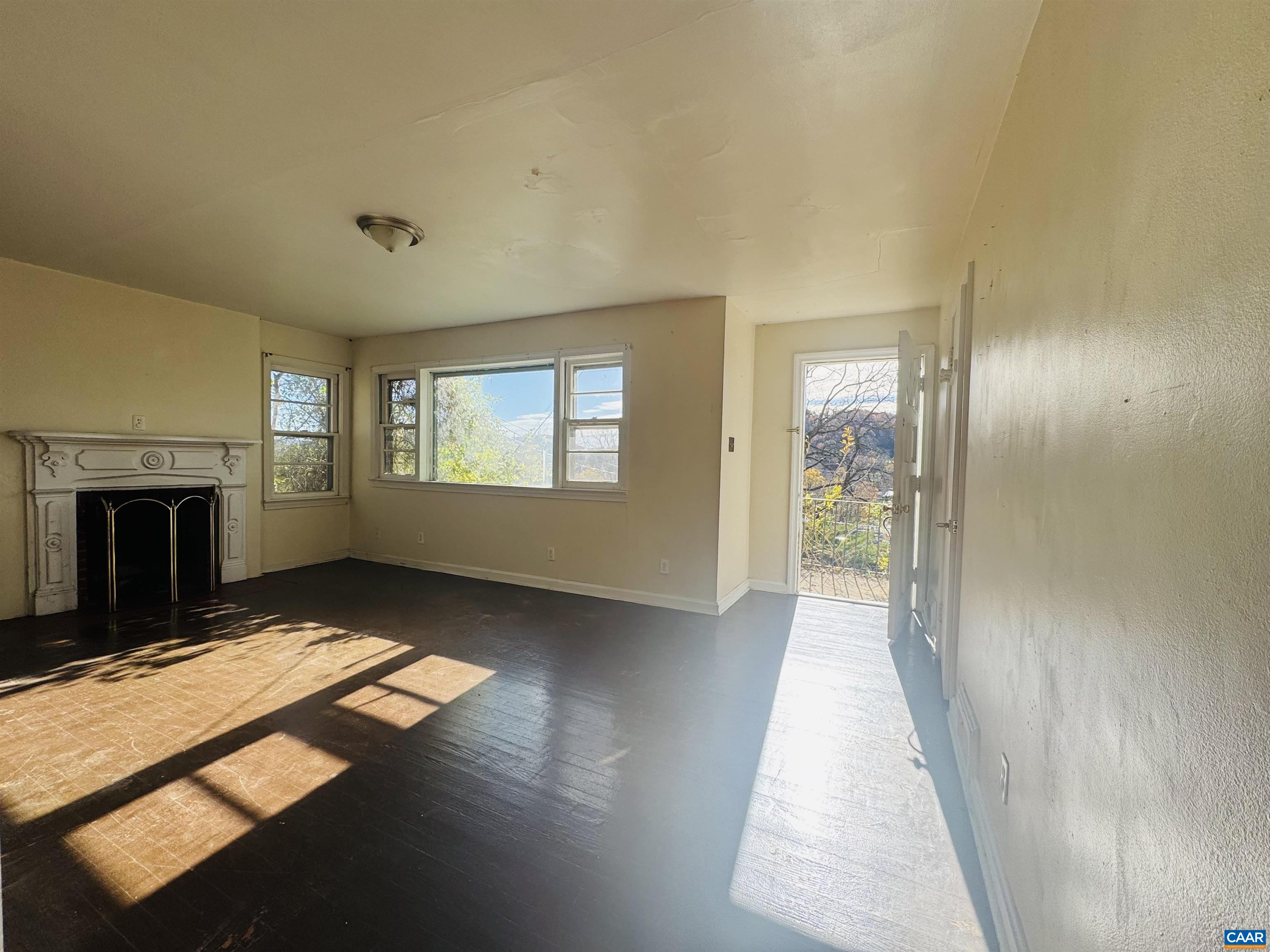 1323 Jackson Street Staunton, VA 24401 - Photo 28 of 67 a view of an empty room with a fireplace and a window