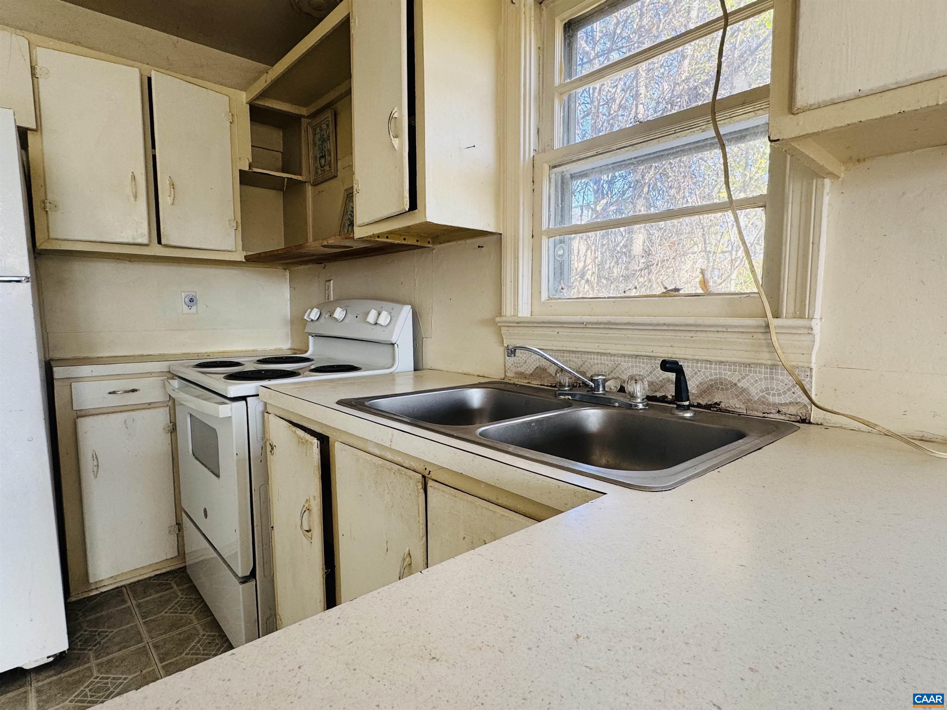 1323 Jackson Street Staunton, VA 24401 - Photo 47 of 67 a kitchen with stainless steel appliances a sink a stove and a microwave