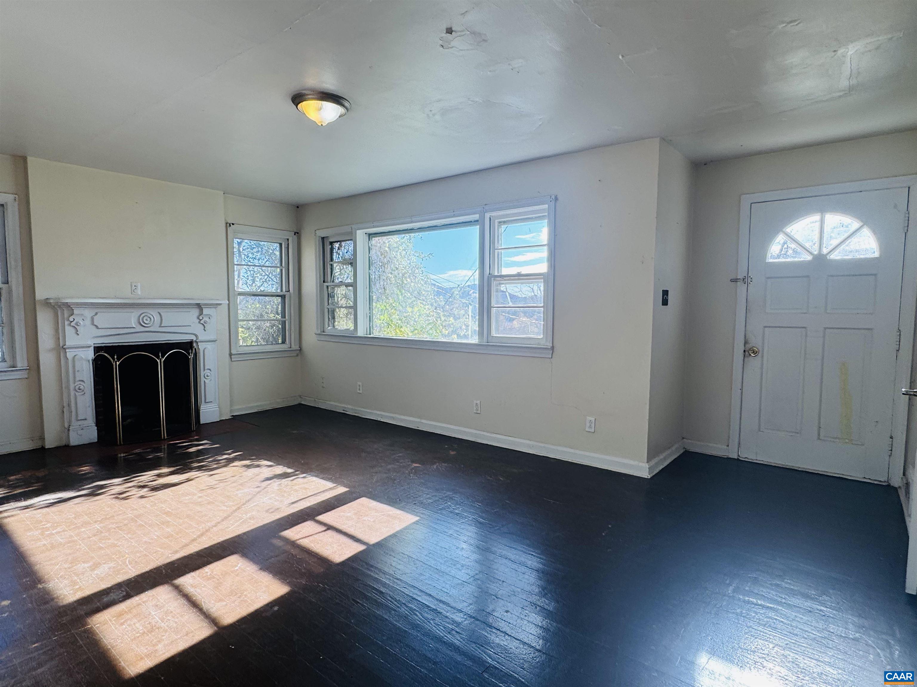 1323 Jackson Street Staunton, VA 24401 - Photo 49 of 67 an empty room with windows and fireplace