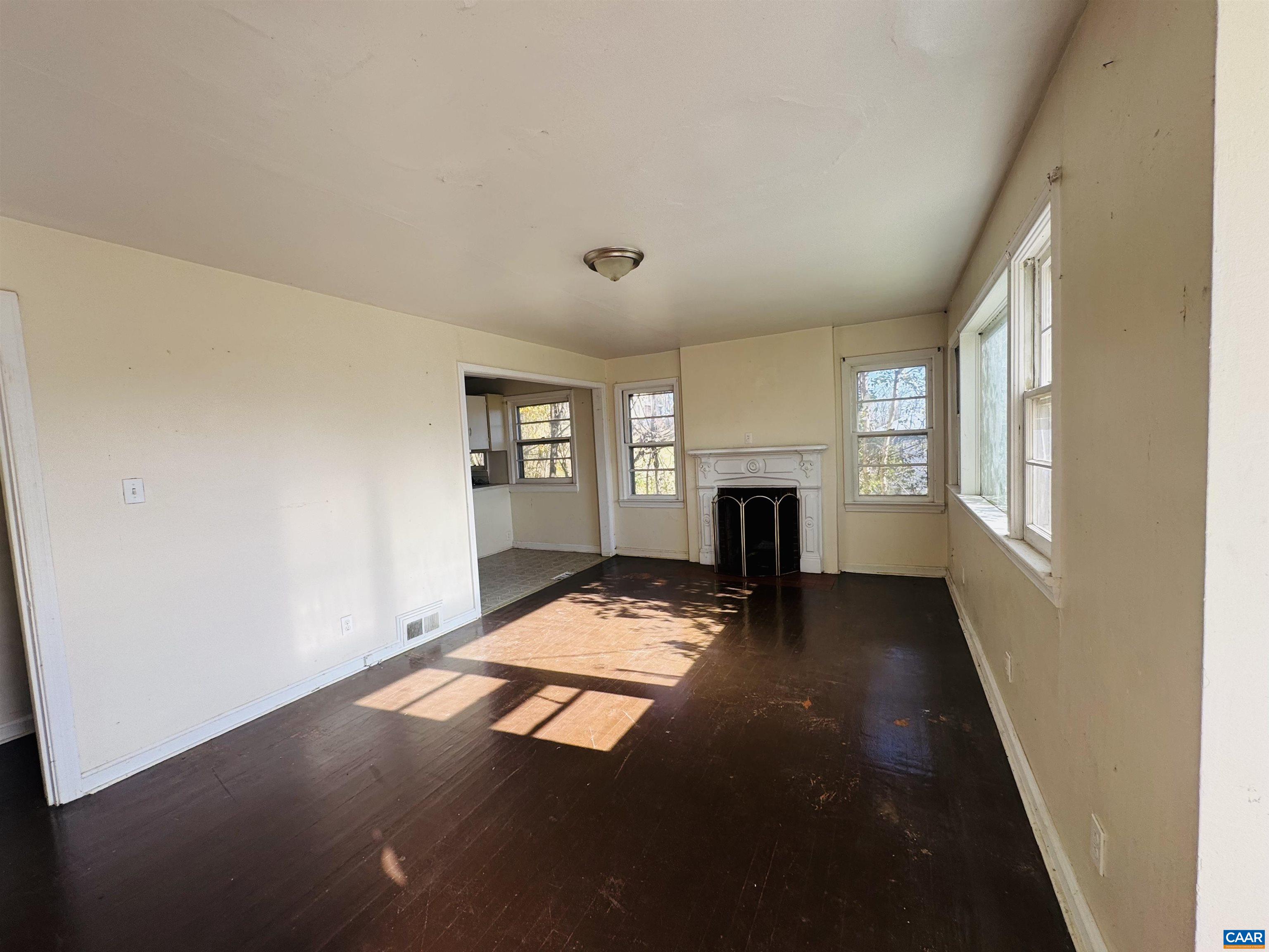 1323 Jackson Street Staunton, VA 24401 - Photo 9 of 67 a view of empty room with fireplace and wooden floor