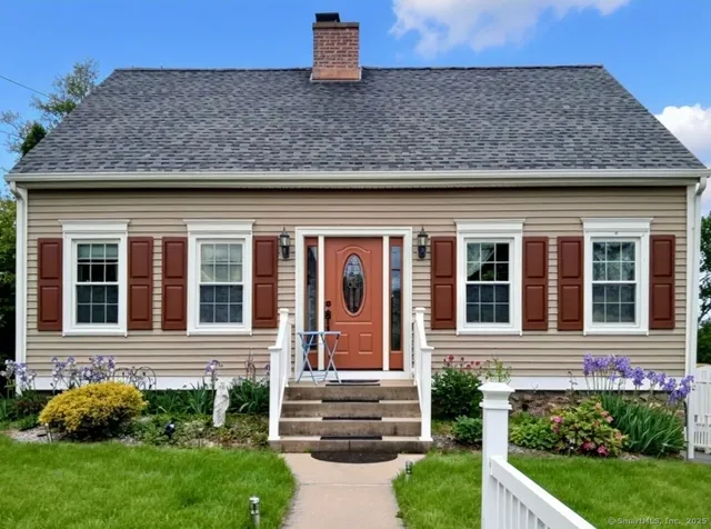 a front view of a house with garden