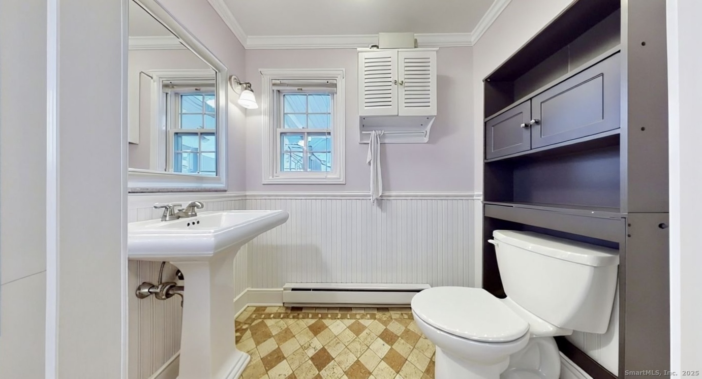 70 Lawlor Street Waterbury, CT 06708 - Photo 11 of 39 a bathroom with a sink a toilet and a mirror