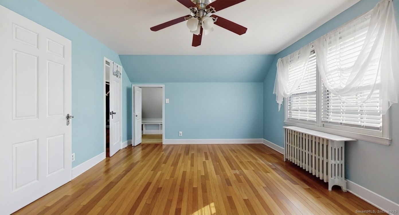 70 Lawlor Street Waterbury, CT 06708 - Photo 13 of 39 a view of empty room with wooden floor and fan