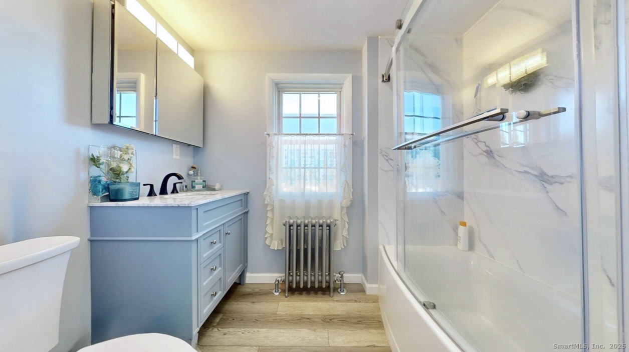 70 Lawlor Street Waterbury, CT 06708 - Photo 15 of 39 a bathroom with a sink a toilet and shower