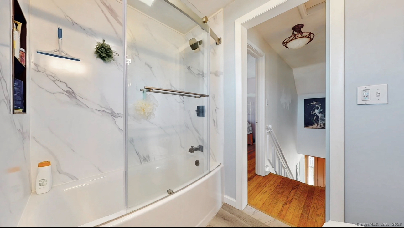 70 Lawlor Street Waterbury, CT 06708 - Photo 16 of 39 a bathroom with a bathtub and a shower
