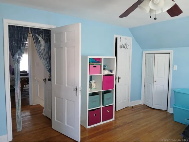 a view of an entryway with wooden floor