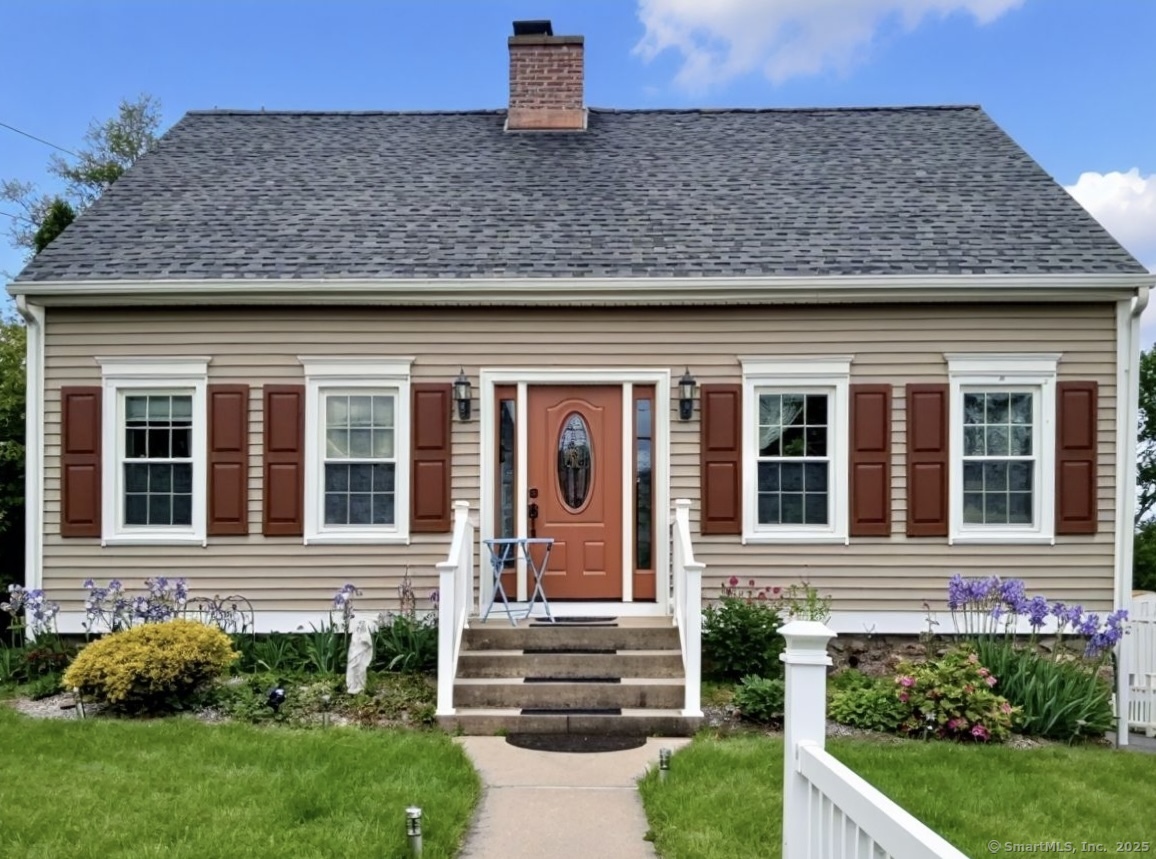 70 Lawlor Street Waterbury, CT 06708 - Photo 21 of 39 a front view of a house with garden