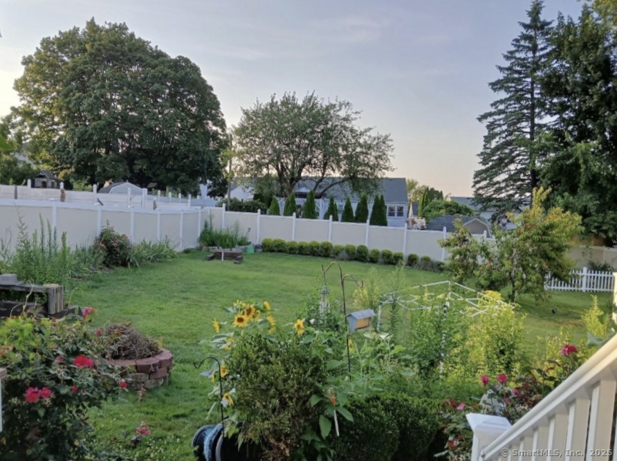70 Lawlor Street Waterbury, CT 06708 - Photo 25 of 39 a view of a garden with large trees