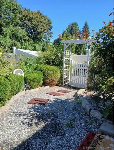 a wooden fence with some trees in the background