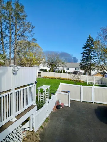 a view of a chairs and table on the deck