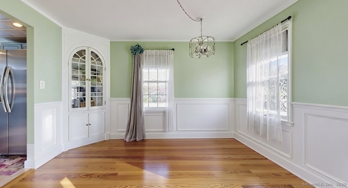 70 Lawlor Street Waterbury, CT 06708 - Photo 5 of 39 a view of livingroom with hardwood floor and window