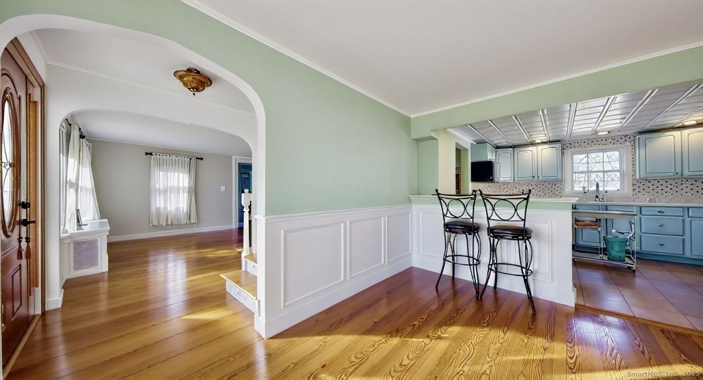 70 Lawlor Street Waterbury, CT 06708 - Photo 6 of 39 a view of kitchen with furniture and wooden floor