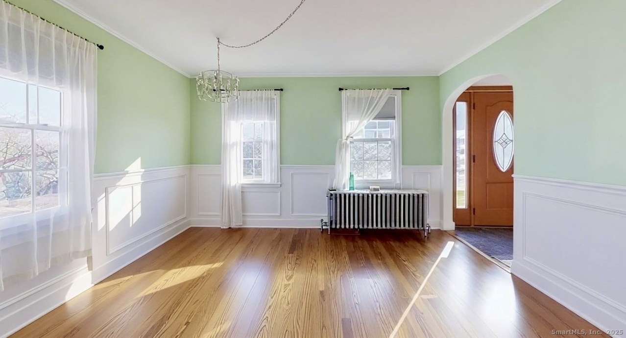 70 Lawlor Street Waterbury, CT 06708 - Photo 7 of 39 a view of an empty room with wooden floor and a window