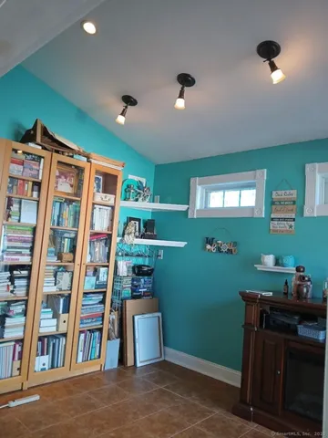 a room with furniture and a book shelf