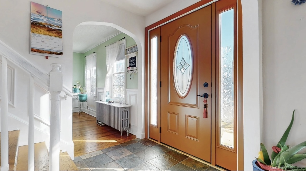 70 Lawlor Street Waterbury, CT 06708 - Photo 8 of 39 a view of an entryway with wooden floor and door