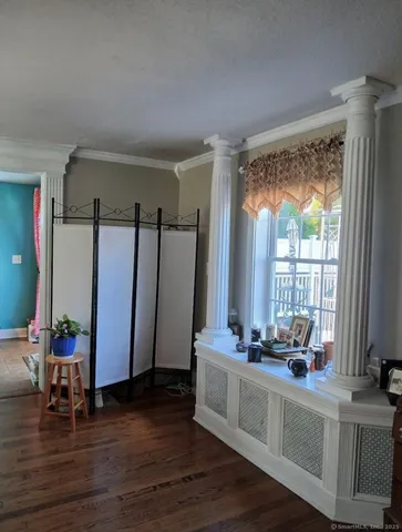 a view of living room with furniture and large window