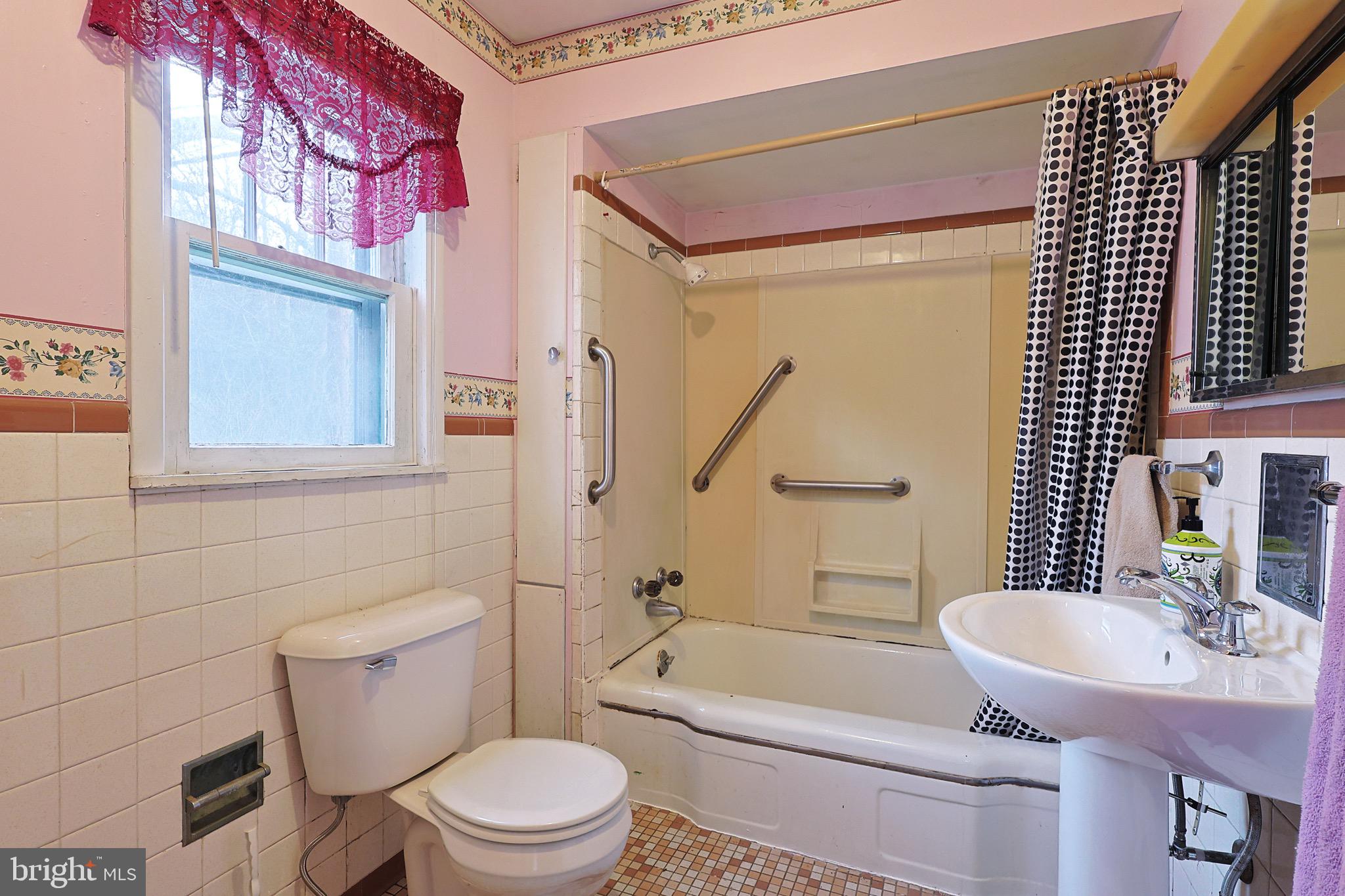159 Rocket Center Road Keyser, WV 26726 - Photo 32 of 64 a bathroom with a sink a toilet a mirror and shower