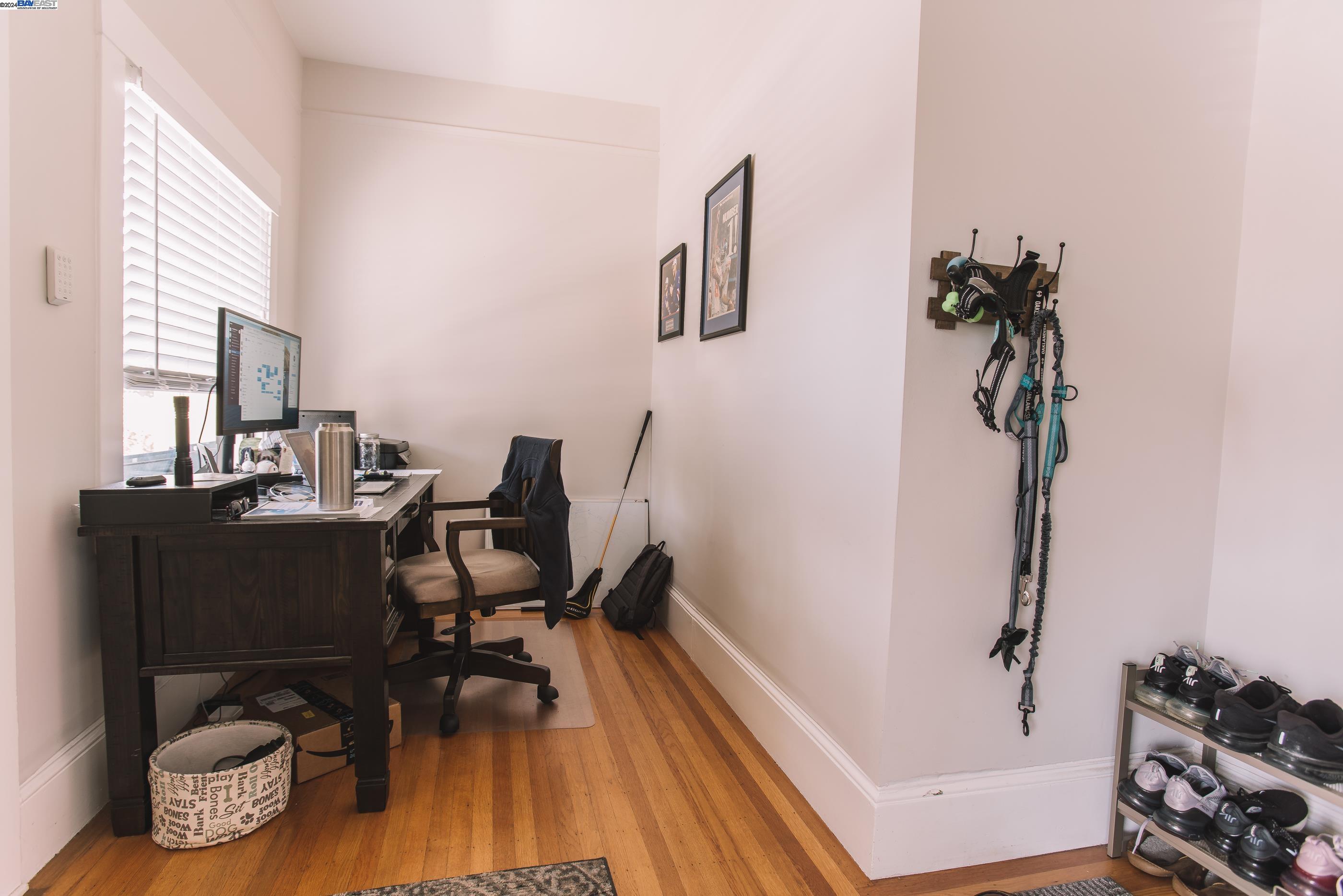 4113 Gilbert Street Oakland, CA 94611 - Photo 12 of 22 a view of a workspace with furniture and wooden floor