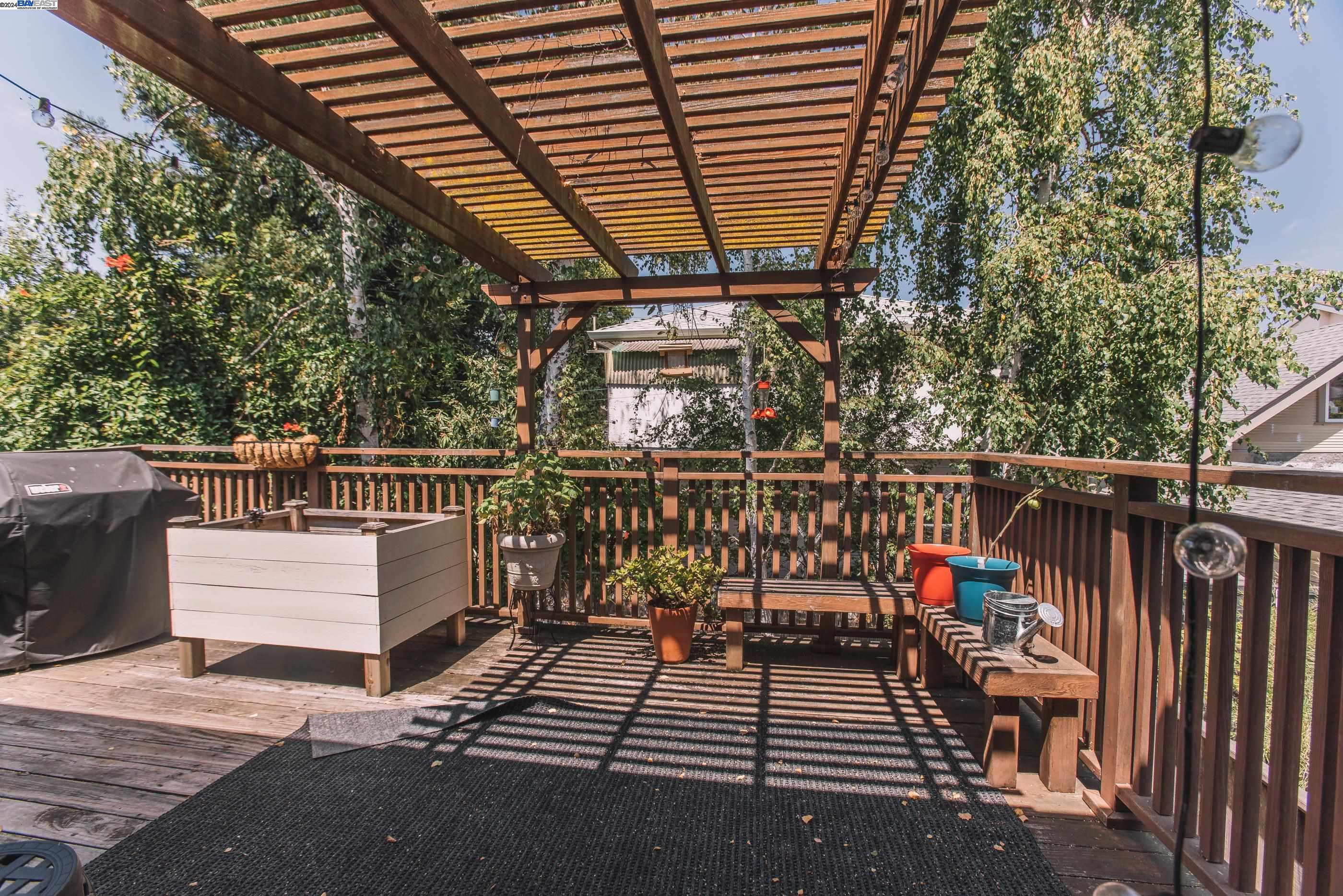 4113 Gilbert Street Oakland, CA 94611 - Photo 13 of 22 a view of a balcony with wooden floor