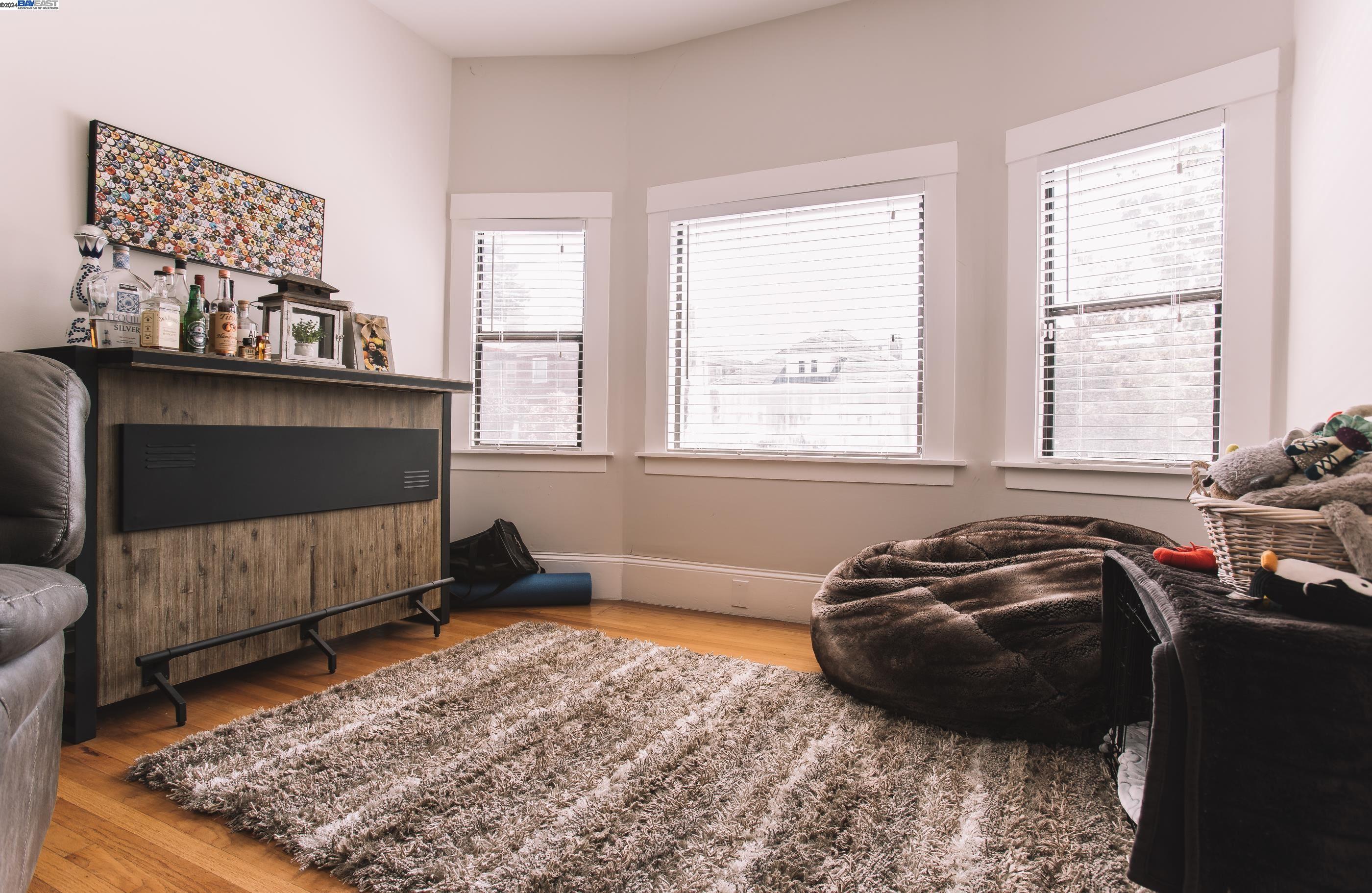 4113 Gilbert Street Oakland, CA 94611 - Photo 2 of 22 a bed room with a bed and a window