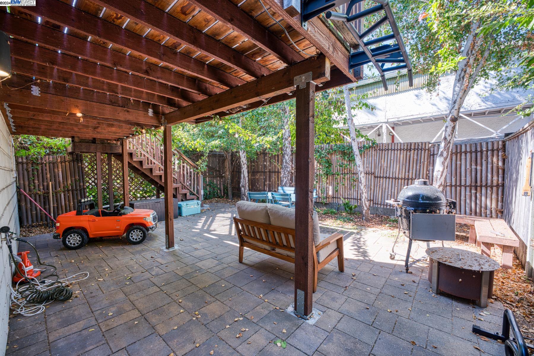 4113 Gilbert Street Oakland, CA 94611 - Photo 21 of 22 a outdoor space with patio lots of furniture and garden view