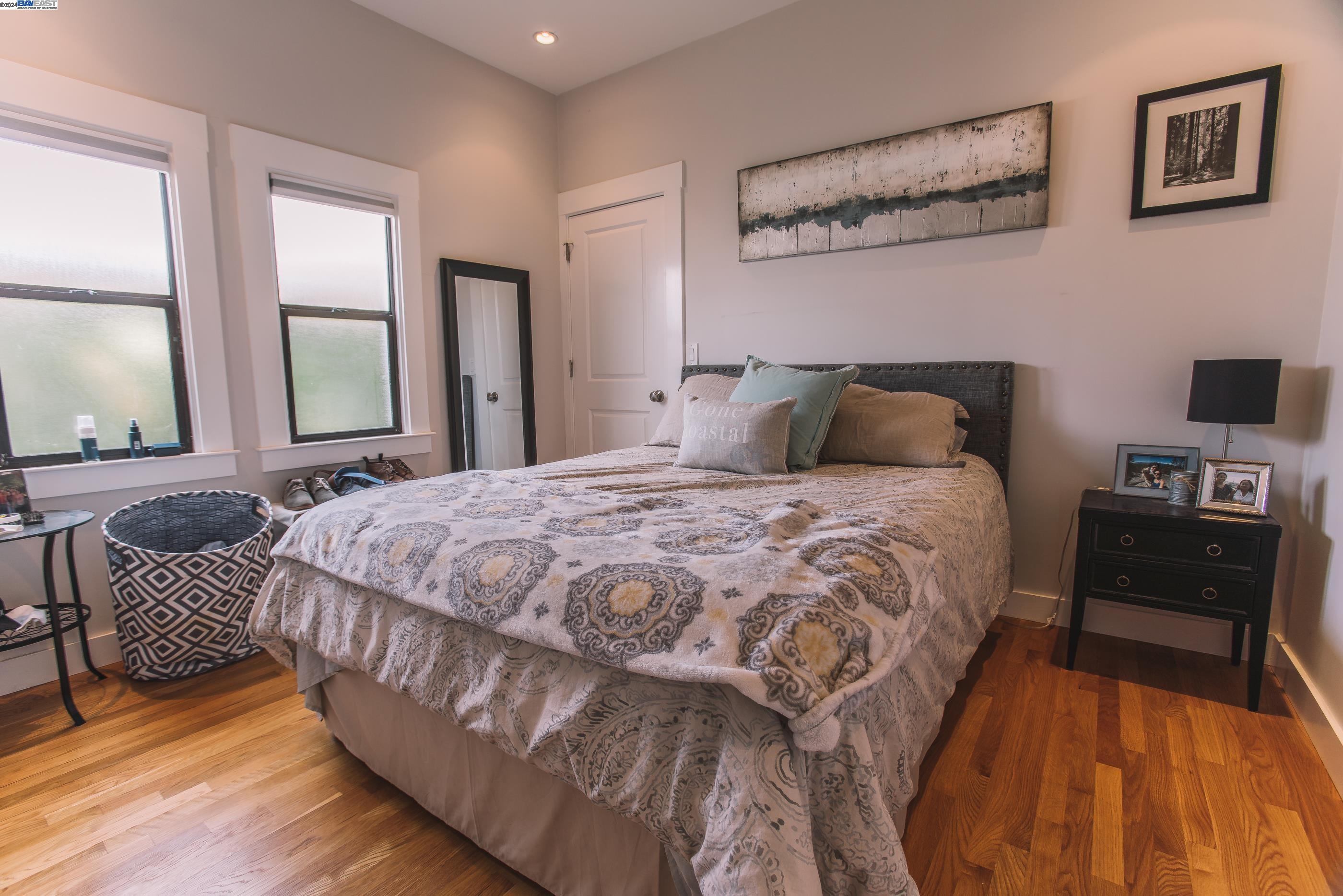 4113 Gilbert Street Oakland, CA 94611 - Photo 8 of 22 a bedroom with a bed and wooden floor