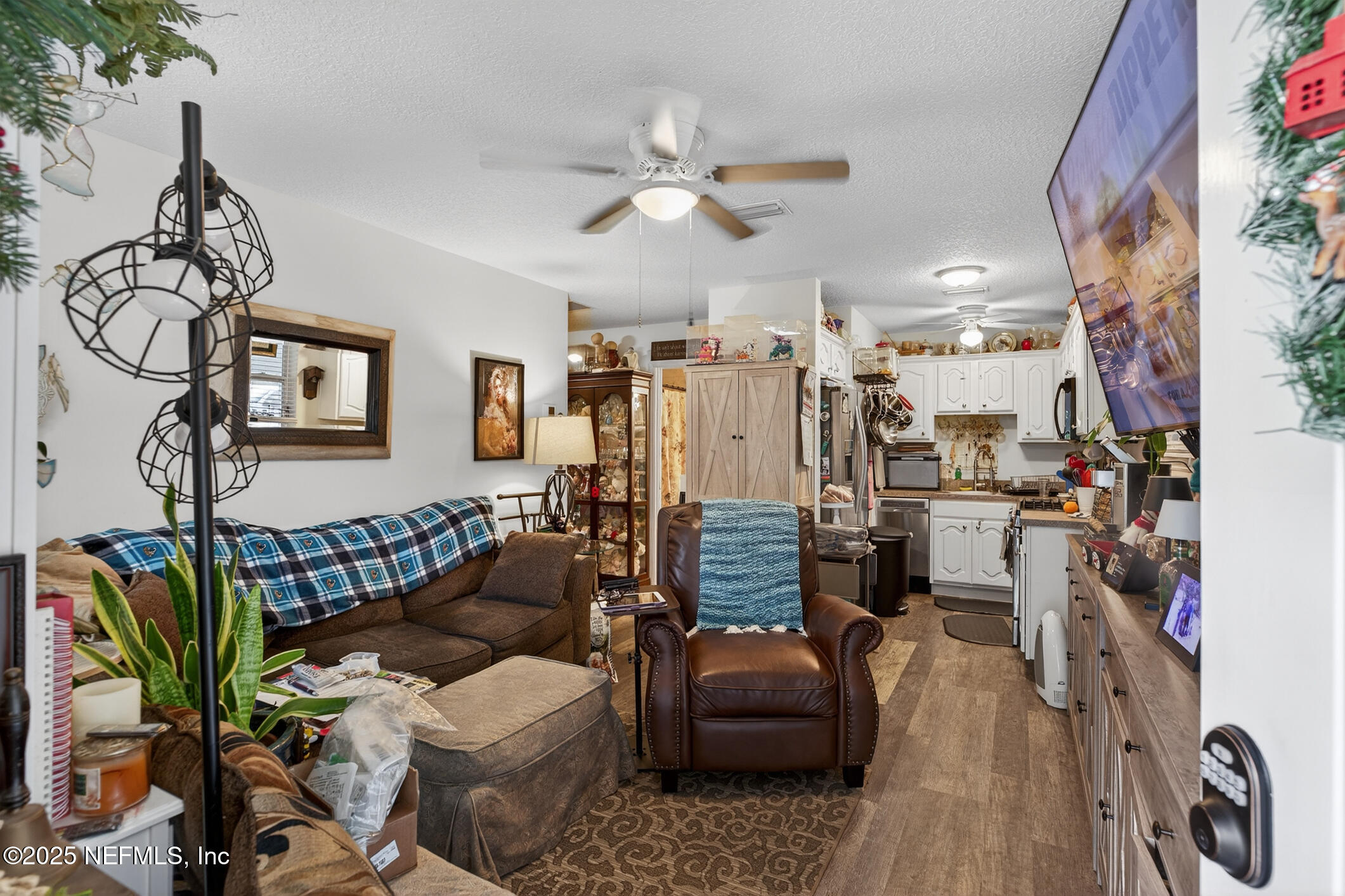44108 Becker Avenue Callahan, FL 32011 - Photo 18 of 28 a living room with furniture and wooden floor