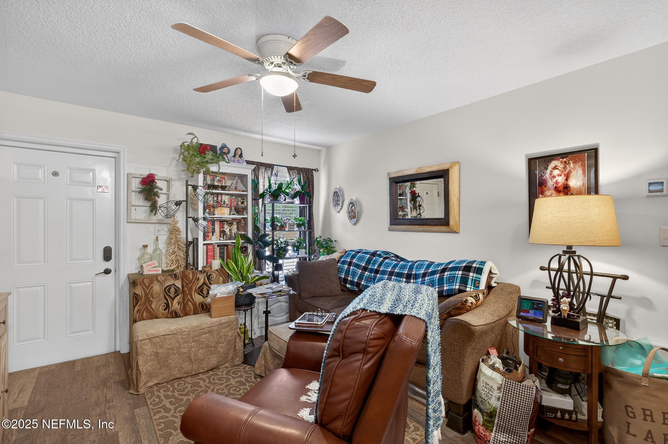 44108 Becker Avenue Callahan, FL 32011 - Photo 19 of 28 a living room with furniture and a lamp