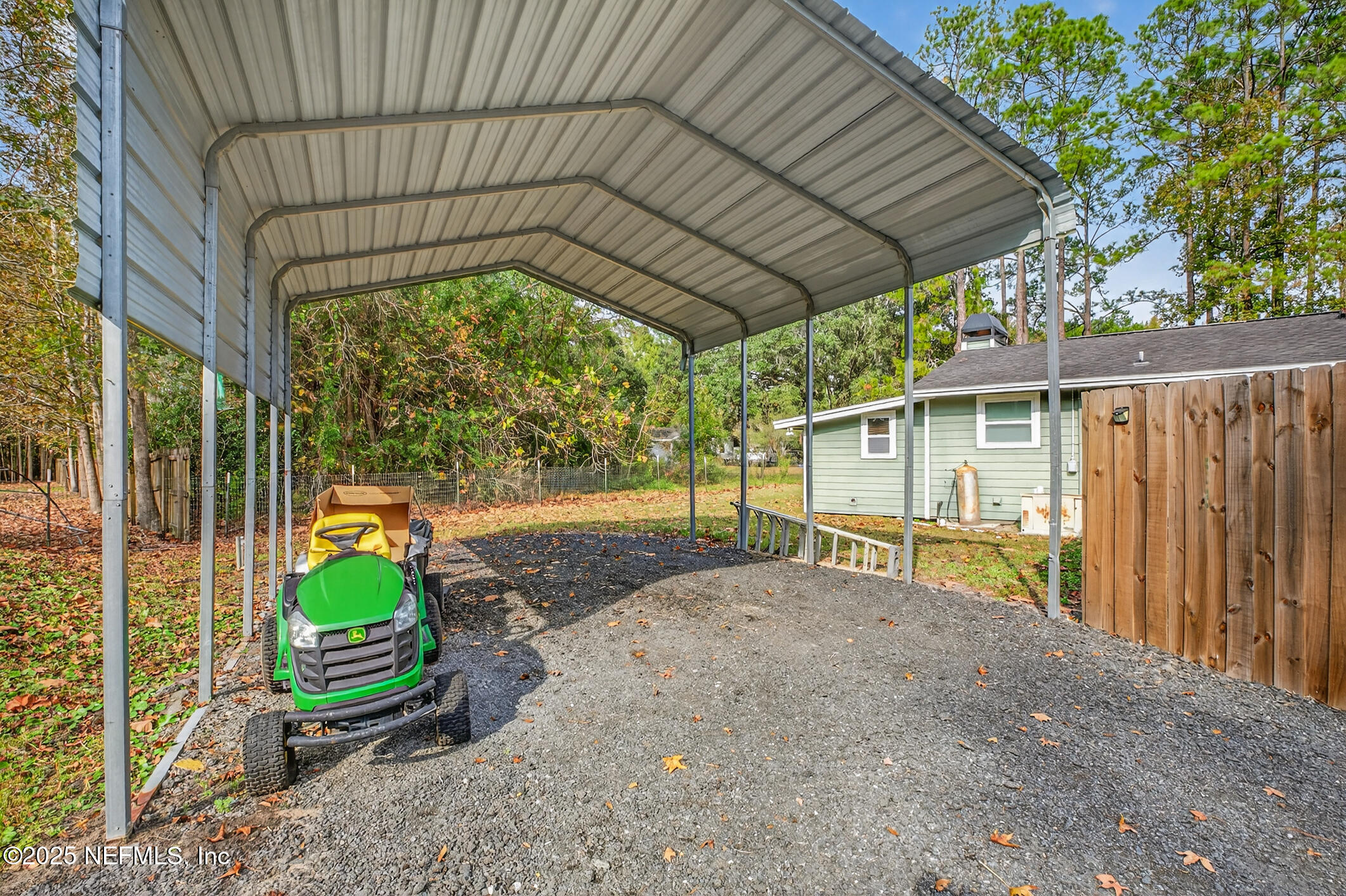 44108 Becker Avenue Callahan, FL 32011 - Photo 25 of 28 a backyard of a house with a garden and barbeque oven