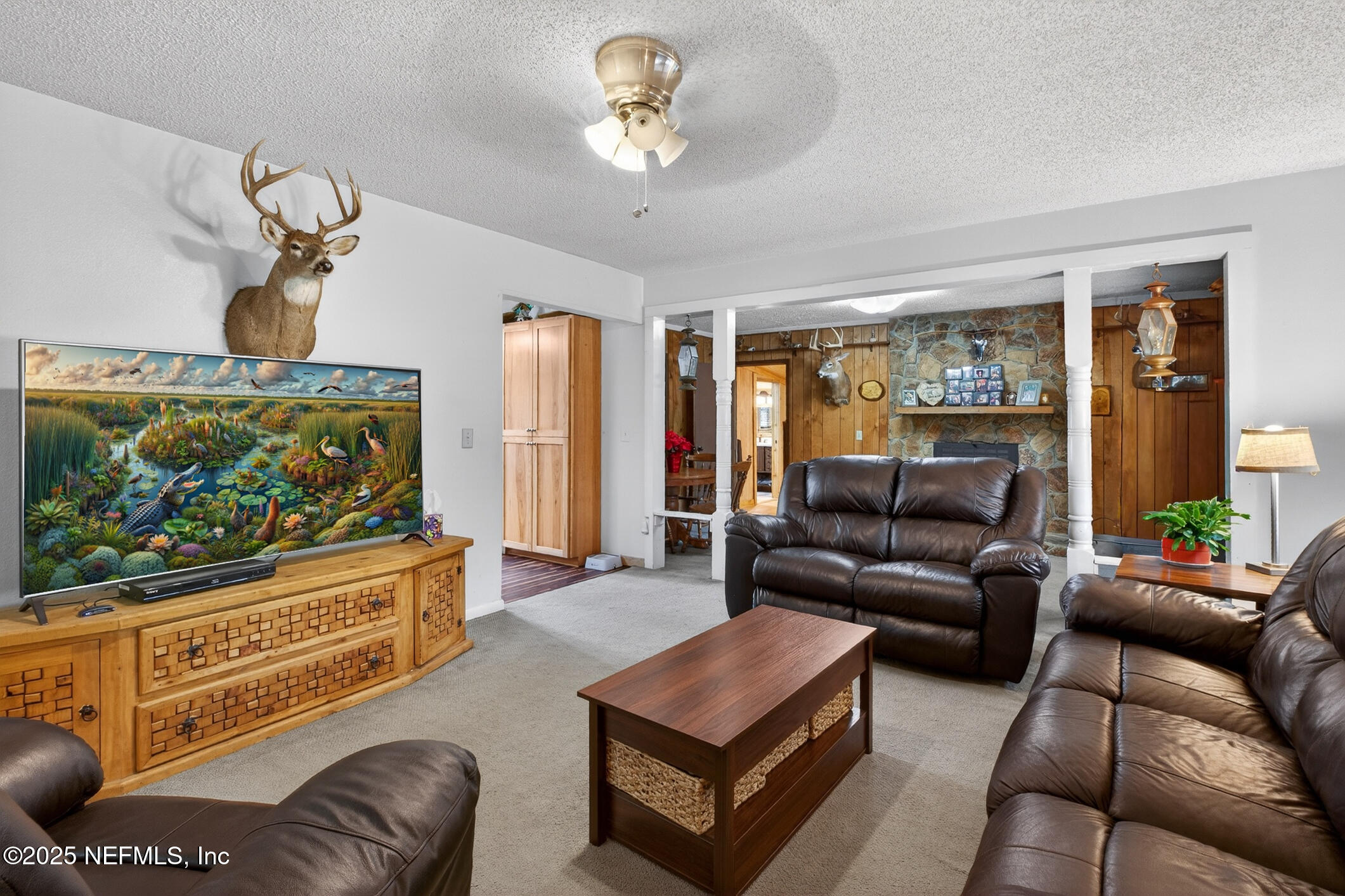 44108 Becker Avenue Callahan, FL 32011 - Photo 4 of 28 a living room with furniture and a flat screen tv