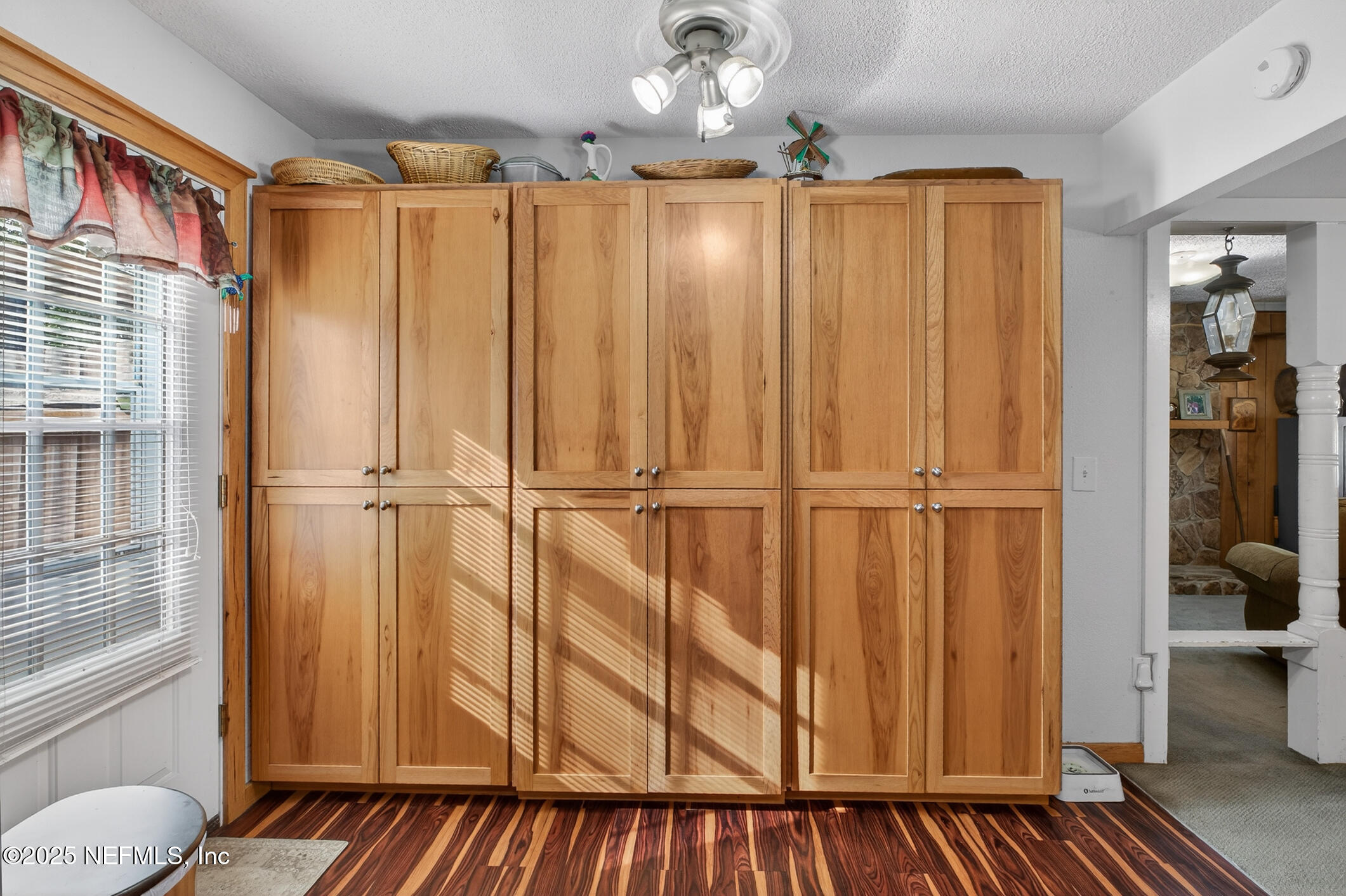 44108 Becker Avenue Callahan, FL 32011 - Photo 7 of 28 a view of a closet area with wooden floor
