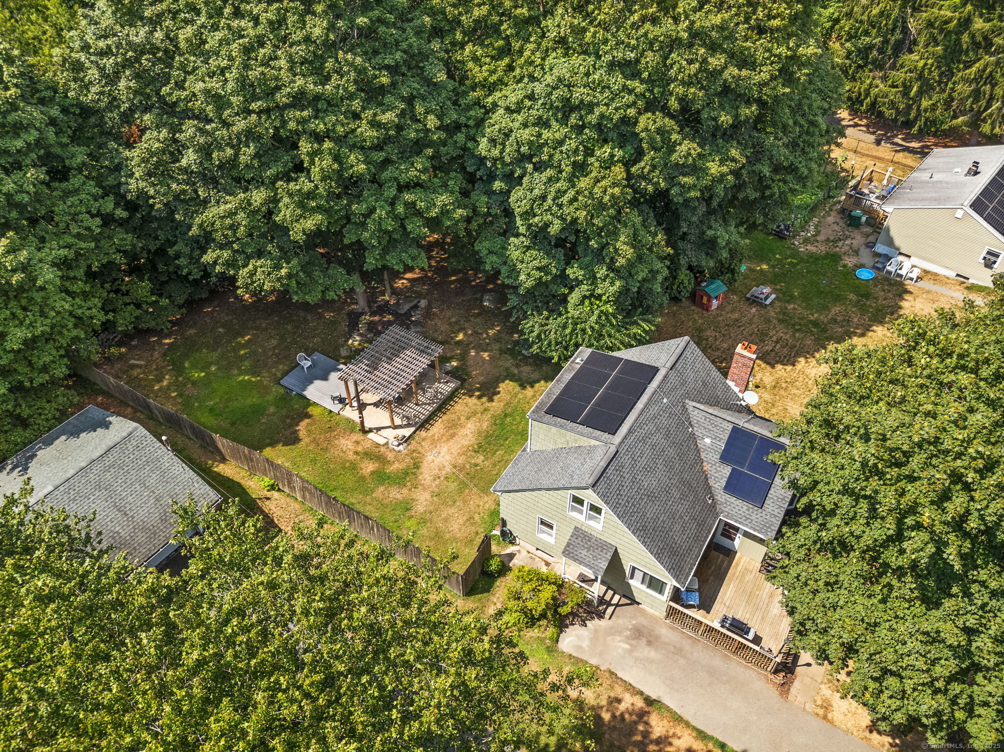 24 Pine Street Waterford, CT 06385 - Photo 31 of 39 an aerial view of a house with a yard and trees
