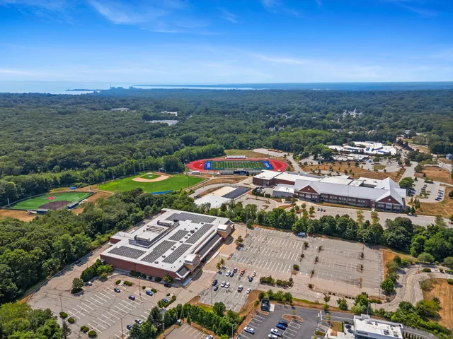 an aerial view of residential houses with outdoor space