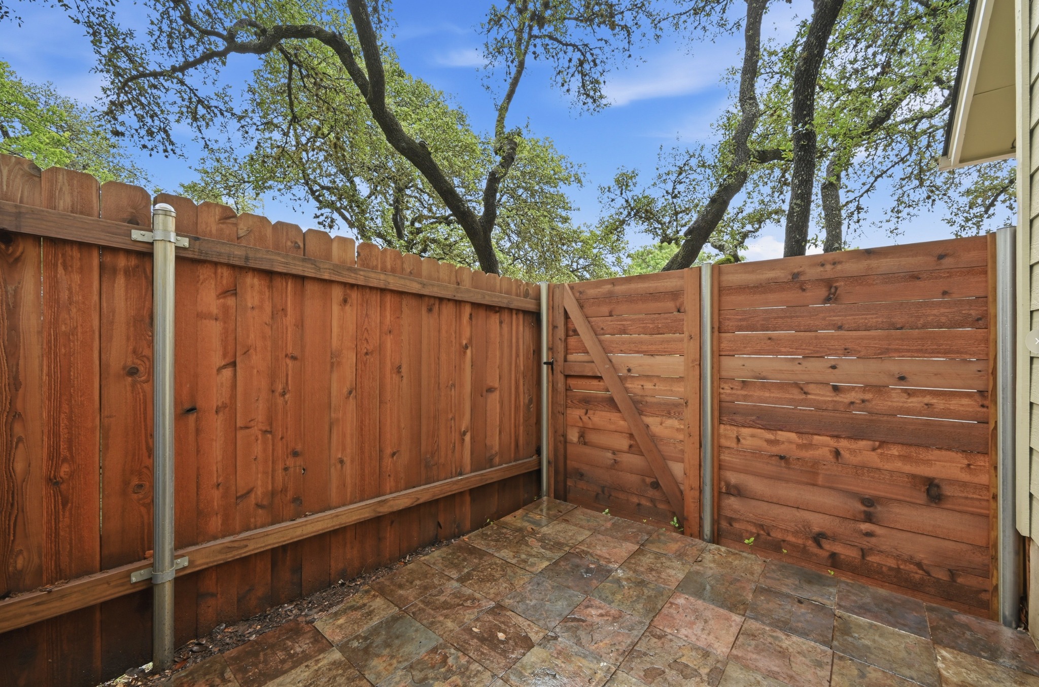 1504 Allen Road, Unit B Austin, TX 78746 - Photo 20 of 22 Patio with slate tile. Plenty of space for patio table and chairs
