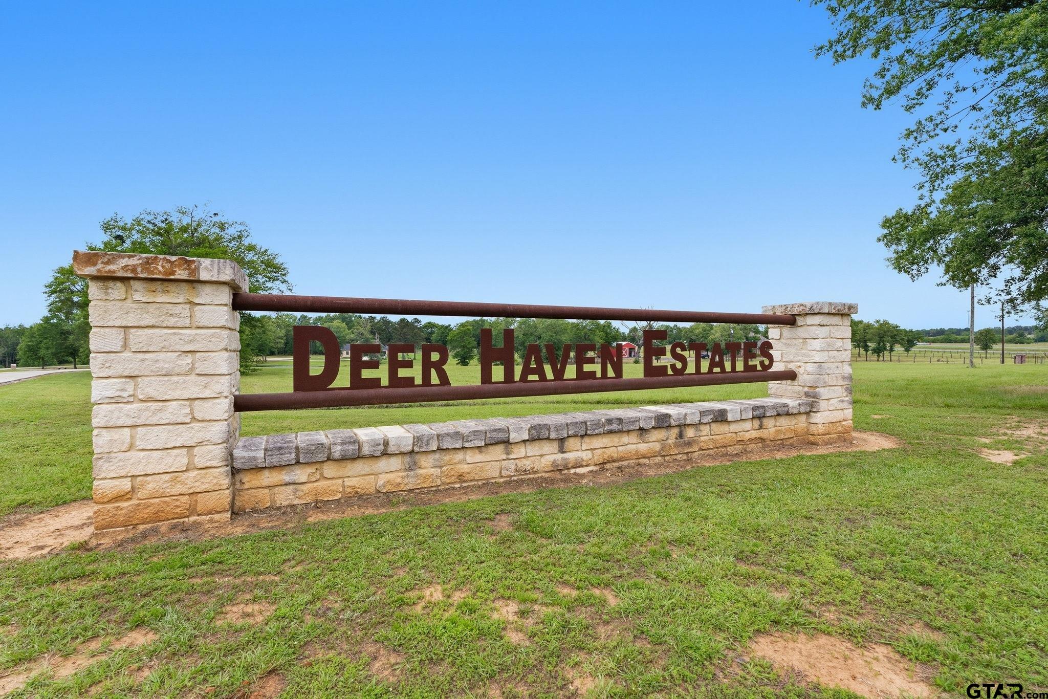 Lot 4 Deer Hvn Road Tyler, TX 75702 - Photo 1 of 11 a sign of golf club on a wall under a tree