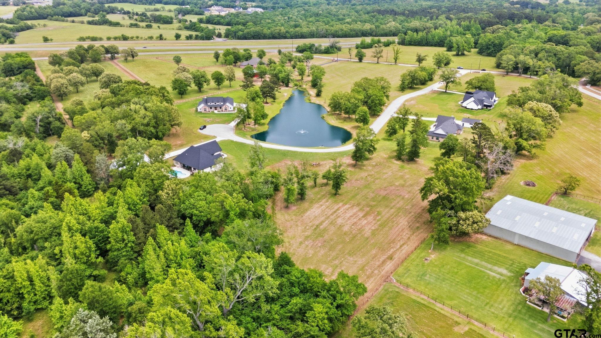 Lot 4 Deer Hvn Road Tyler, TX 75702 - Photo 3 of 11 a view of swimming pool with a garden and seating area