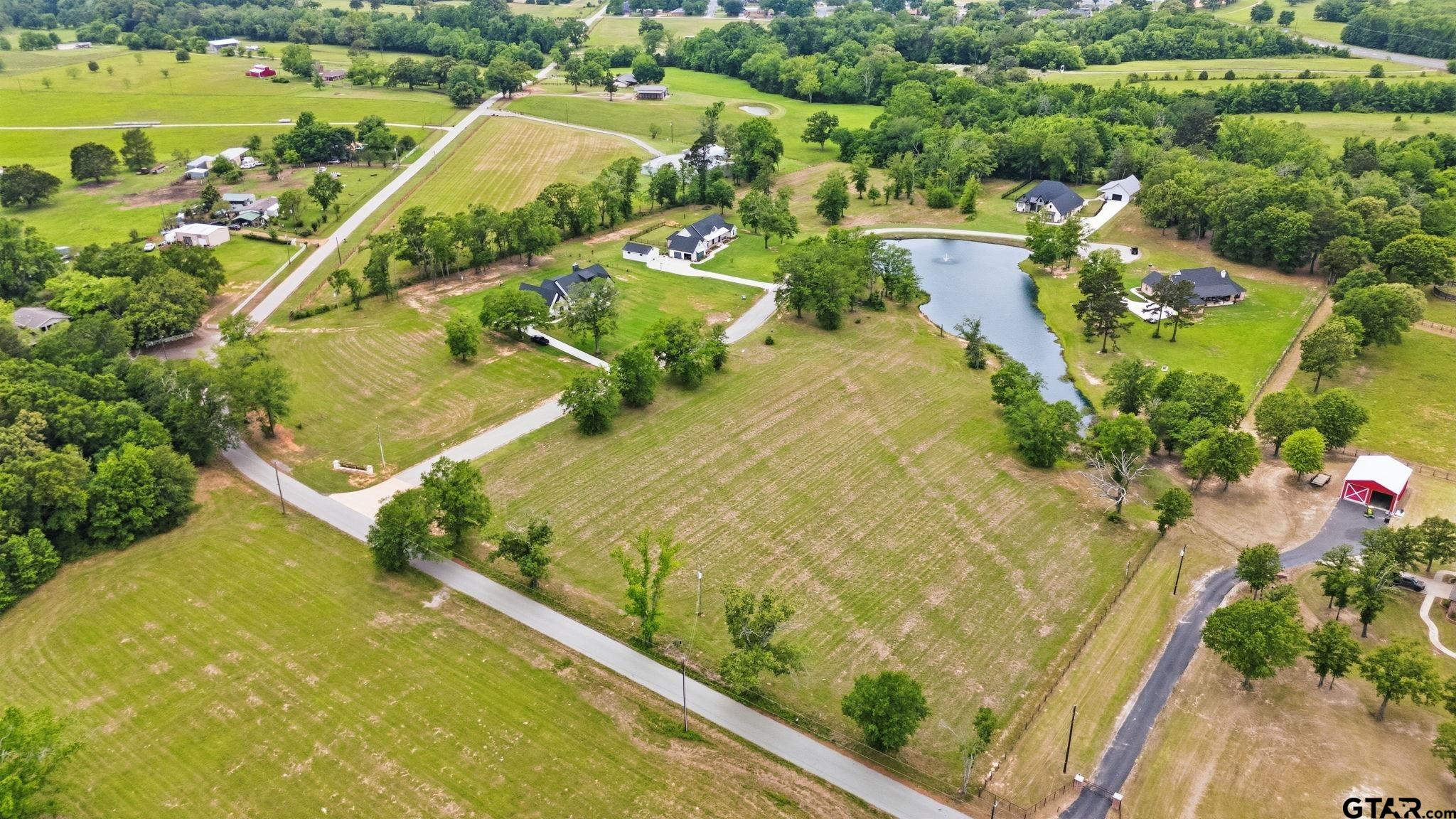 Lot 4 Deer Hvn Road Tyler, TX 75702 - Photo 9 of 11 an aerial view of residential houses with outdoor space and swimming pool