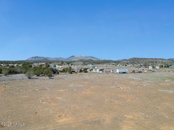 a view of lake with mountain in the background